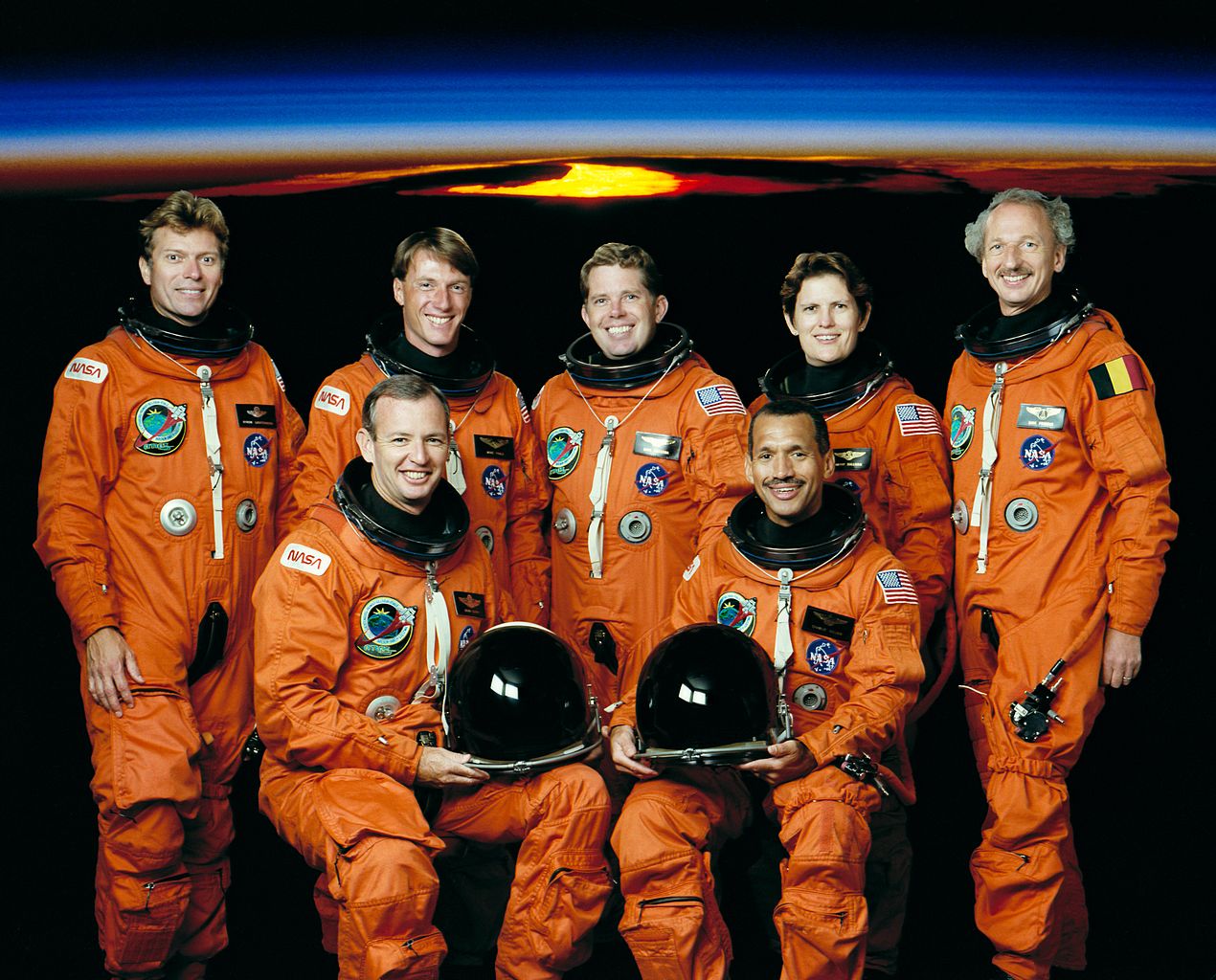 STS‑45 crew photo with, from left to right, in front: pilot Brian Duffy and commander Charles F. Bolden Jr.; backed by payload specialist Byron K. Lichtenberg, mission specialist C. Michael Foale, mission specialist David C. Leestma, payload commander Kathryn D. Sullivan and payload specialist Dirk D. Frimout. Image credit: NASA
